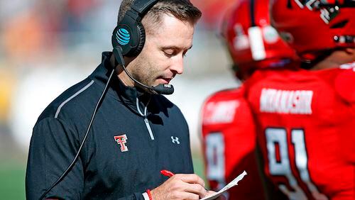Texas Tech coach Kliff Kingsbury looks down at his notes during the second half of the NCAA college football game TCU, Saturday, Nov. 18, 2017, in Lubbock, Texas. (AP Photo/Brad Tollefson)