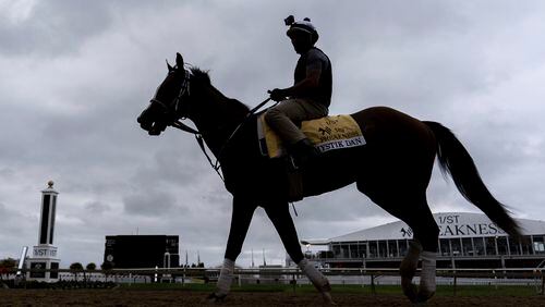 Kentucky Derby winner and Preakness Stakes entrant Mystik Dan works out ahead of the 149th running of the Preakness Stakes horse race at Pimlico Race Course, Friday, May 17, 2024, in Baltimore. (AP Photo/Julia Nikhinson)