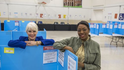 Nina Altschiller, left, and Chassidy Malloy, right, of the League of Women Voters of Coastal Georgia, pose at the Chatham County Voter Registration auxiliary office Wednesday, April 17, 2024, in Savannah, Ga. (Stephen B. Morton for The Atlanta Journal-Constitution)