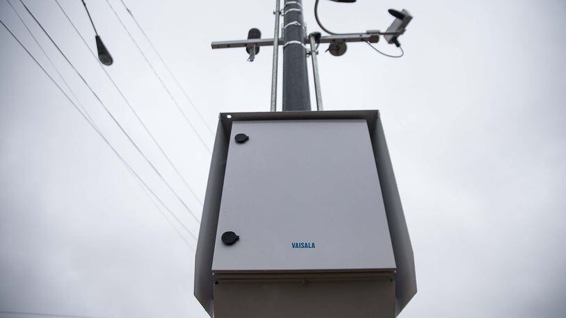12/23/2019 — Atlanta, Georgia — A Road Weather Information System sensor is mounted on a pole along North Druid Hills Road NE in Atlanta, Monday, December 23, 2019. The city of Brookhaven is, to its knowledge, the first government to partner with Georgia DOT to install a Road Weather Information System sensor. The device, installed at the intersection of Buford Highway and North Druid Hills Road, can provide real-time data on weather factors including pavement conditions, precipitation amounts and visibility. (ALYSSA POINTER/ALYSSA.POINTER@AJC.COM)