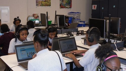 Students at Riverdale’s DuBois Integrity Academy have laptops in every classroom, and third through fifth graders have personal computers they take home to complete assignments and projects. Credit: DuBois Integrity Academy.