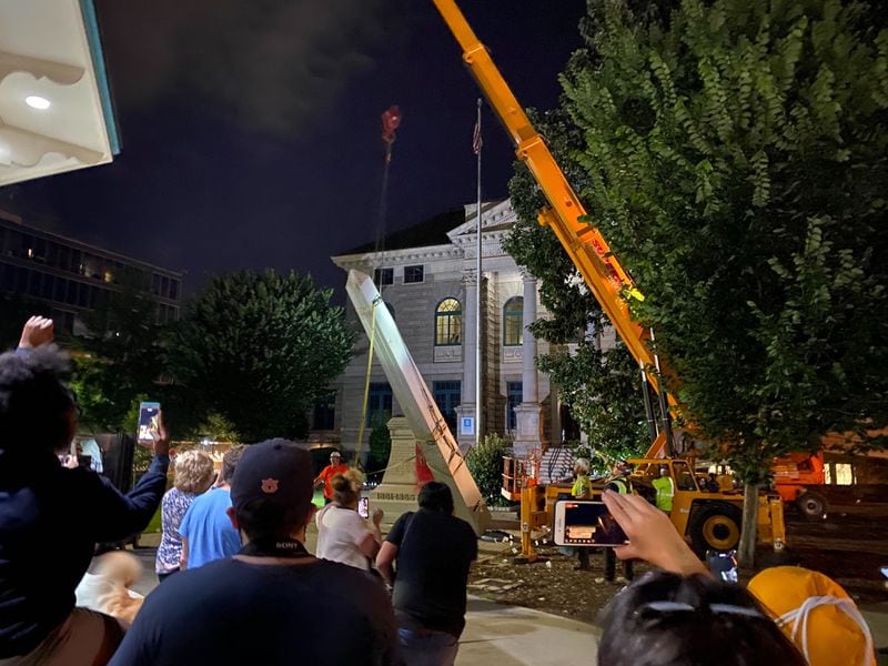 The 30-foot obelisk Confederate moment, which has stood for 112 years, was taken down in the downtown Decatur square on the night of June 18, 2020. The monument was erected in 1908 by the United Daughters of the Confederacy. (Amanda Coyne / AJC)