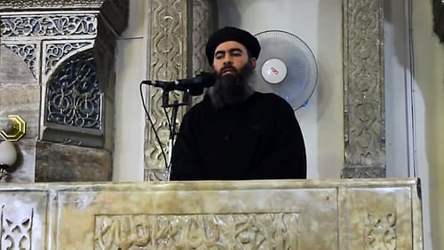 An image grab taken from a video released on July 5, 2014 by Al-Furqan Media shows alleged Islamic State of Iraq and the Levant (ISIL) leader Abu Bakr al-Baghdadi preaching during Friday prayer at a mosque in Mosul.(Photo by Al-Furqan Media/Anadolu Agency/Getty Images)