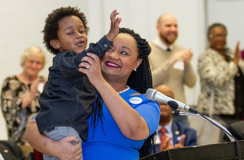 Georgia state Sen. Nikema Williams holds her son Carter Small after Williams at the state convention. STEVE SCHAEFER / SPECIAL TO THE AJC