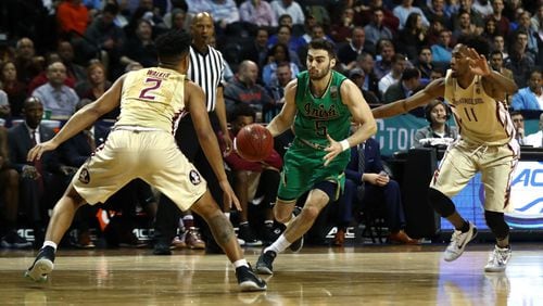 Matt Farrell of the Notre Dame Fighting Irish drives against CJ Walker (2) of the Florida State Seminoles during the Semi Finals of the ACC Basketball Tournament at the Barclays Center on March 10, 2017 in New York City. (Photo by Al Bello/Getty Images)