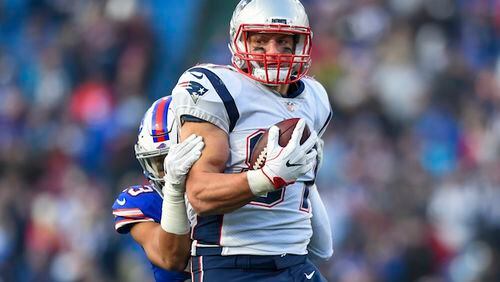 New England Patriots tight end Rob Gronkowski (87) is tackled by Buffalo Bills strong safety Micah Hyde (23) during the second half of an NFL football game, Sunday, Dec. 3, 2017, in Orchard Park, N.Y. The Patriots won 23-3. (AP Photo/Rich Barnes)