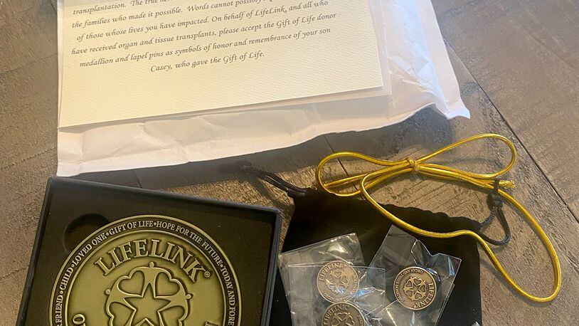 The certificate and tokens that LifeLink Foundation sent Noelle Maloney as a thank you for donating her son's organs. Courtesy of Noelle Maloney