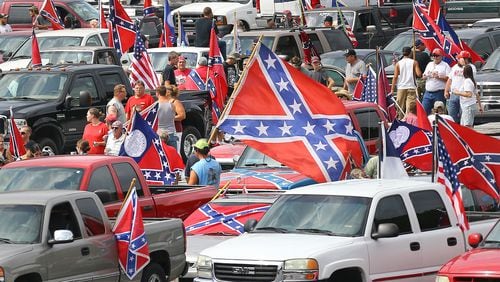Hundreds of Confederate flag enthusiasts rallied at Stone Mountain Park Aug. 1, attracting a handful of counter protesters.