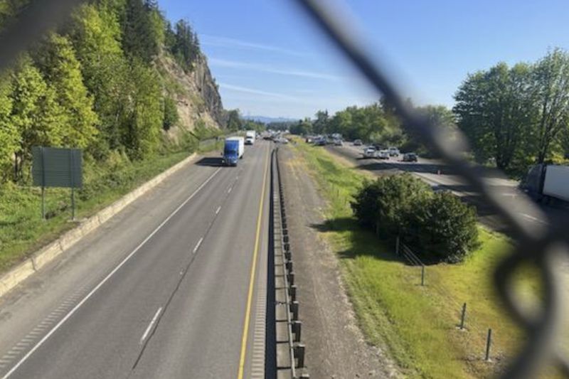 This image provided by KEZI 9 News shows Interstate 5 on Tuesday, April 23, 2024, near Eugene, Ore., after a former Washington state police officer wanted after killing two people, including his ex-wife, was found with a self-inflicted gunshot wound following a chase in Oregon, authorities said. His 1-year-old baby, who was with him, was taken safely into custody by Oregon State Police troopers. (KEZI 9 News via AP)