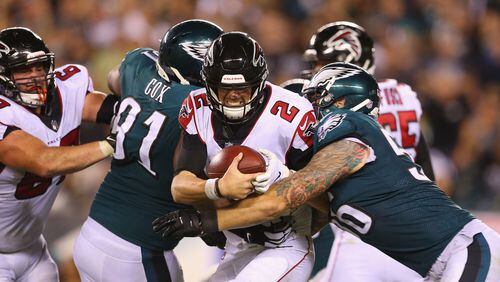 Falcons' Matt Ryan is sacked by the Eagles' Chris Long  during the 2018 season opener at Lincoln Financial Field in Philadelphia. The teams will meet again in the 2019 season in Atlanta.