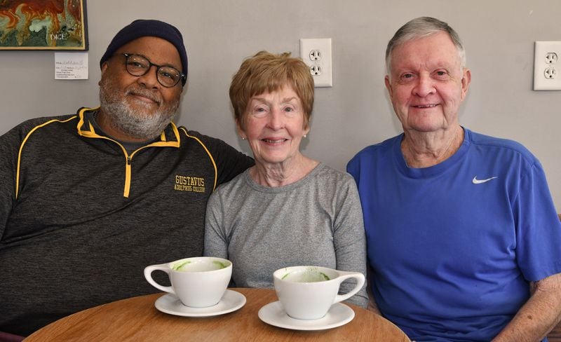 Keith and Martha Cameron are longtime customers at Beans & Butter Coffeehouse in Lawrenceville, where Michael Simmons (left) is the owner.  Photo by Chris Hunt for The Atlanta Journal-Constitution 
