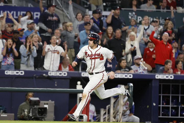 Braves third baseman Austin Riley (27) approaches home plate to score his team's first run during the fourth inning of a baseball game against the New York Mets at Truist Park on Saturday, Oct. 1, 2022. Miguel Martinez / miguel.martinezjimenez@ajc.com
