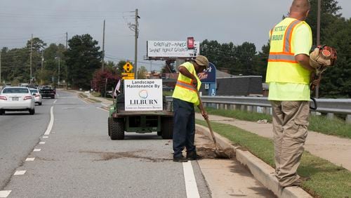 Lilburn CID workers performing landscape maintenance along Lawrenceville Highway. Courtesy Lilburn CID