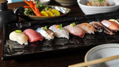 Assorted sushi , takoyaki and pickles at Craft Izakaya. / (Beckysteinphotography.com)