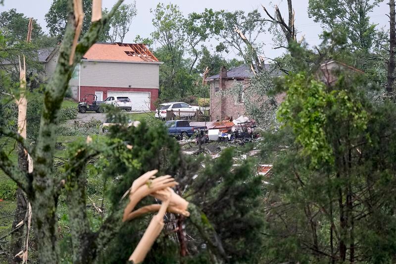 Storm damaged houses are seen along Blackburn Lane, Thursday, May 9, 2024, in Columbia, Tenn. Severe storms tore through the central and southeast U.S., Wednesday, spawning damaging tornadoes, producing massive hail, and killing two people in Tennessee. (AP Photo/George Walker IV)