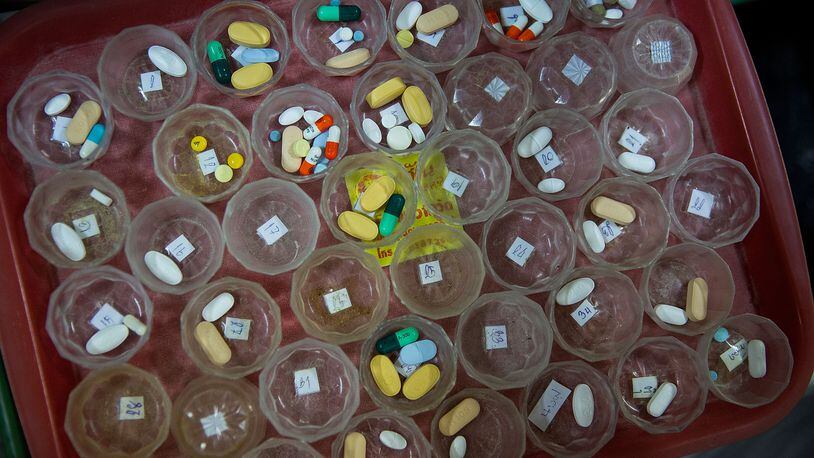 Pills are prepared for HIV/AIDS patients. (Photo by Taylor Weidman/Getty Images)