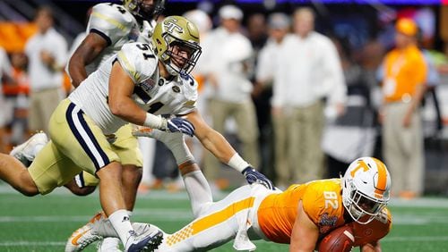 ATLANTA, GA - SEPTEMBER 04:  Ethan Wolf #82 of the Tennessee Volunteers fails to pull in this reception against Brant Mitchell #51 of the Georgia Tech Yellow Jackets at Mercedes-Benz Stadium on September 4, 2017 in Atlanta, Georgia.  (Photo by Kevin C. Cox/Getty Images)