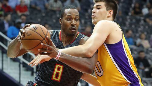 November 2, 2016, ATLANTA: Hawks Dwight Howard drives against Lakers Ivica Zubac during the first period in an NBA basketball game at Philips Arena on Wednesday, Nov. 2, 2016, in Atlanta. Curtis Compton /ccompton@ajc.com
