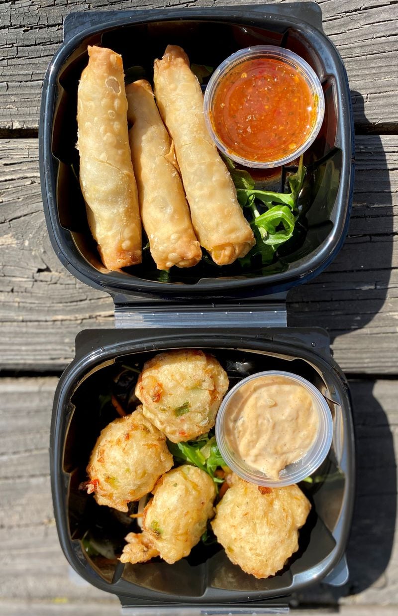 From the appetizer menu of Spicy Hill: akee-salt fish spring rolls and conk fritters. Wendell Brock for The Atlanta Journal-Constitution