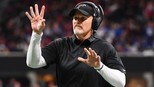 Falcons head coach Dan Quinn signals to an official during the second quarter against the New York Giants Oct. 22, 2018, at Mercedes-Benz Stadium in Atlanta.