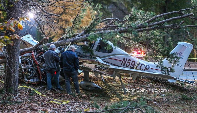 Investigators were at Kennesaw State on Friday morning to check out the wreckage of a small plane that crashed Thursday night. JOHN SPINK / JSPINK@AJC.COM