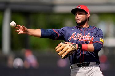 Atlanta Braves second baseman David Fletcher throws out New York Yankees' Juan Soto at first base in the second inning of a spring training baseball game Sunday, March 10, 2024, in Tampa, Fla. (AP Photo/Charlie Neibergall)