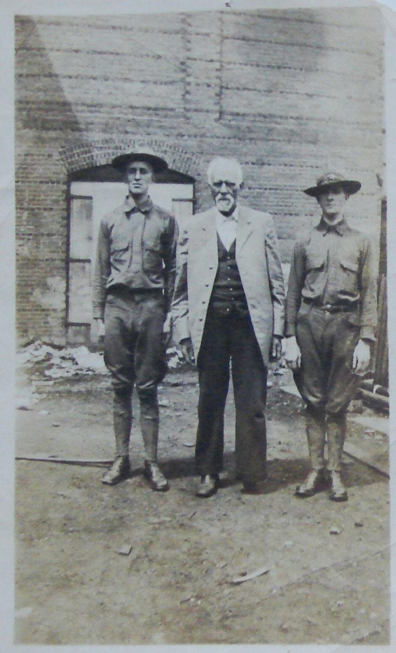 Image of Thomas W. Colley (center) with his sons who served in World War I.
