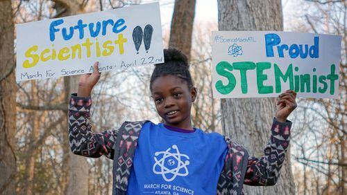 Jayda, the 8-year-old daughter of Atlanta March for Science organizer and Emory microbiologist Jasmine Clark, shows her enthusiasm for science. How do we get more girls to see themselves as scientists? (Photo/Atlanta March for Science)