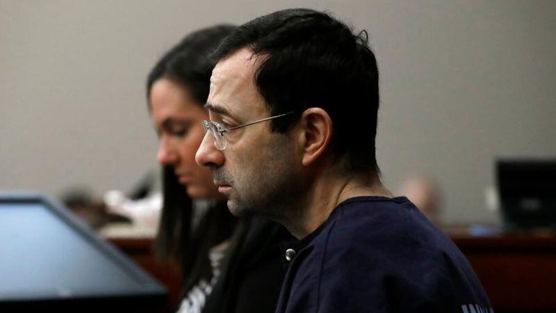 Dr. Larry Nassar listens as a victim gives her impact statement during the seventh day of his sentencing hearing Wednesday, Jan. 24, 2018, in Lansing, Mich. Nassar has admitted sexually assaulting athletes when he was employed by Michigan State University and USA Gymnastics, which is the sport's national governing organization and trains Olympians. (AP Photo/Carlos Osorio)