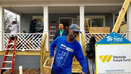 Volunteers work on a Habitat for Humanity home in the Ashview Heights neighborhood near Mercedes-Benz Stadium on Saturday, Jan. 20, 2019. J. SCOTT TRUBEY/STRUBEY@AJC.COM