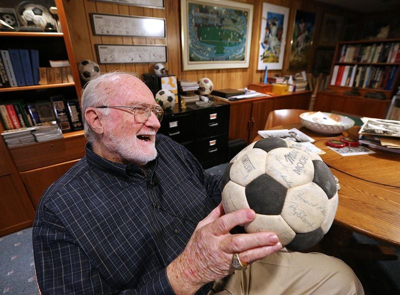 The autographs are a  little faded now on the 1968 Atlanta Chiefs soccer ball prized by the team's vice president at the time, Dick Cecil. (Curtis Compton/ccompton@ajc.com)