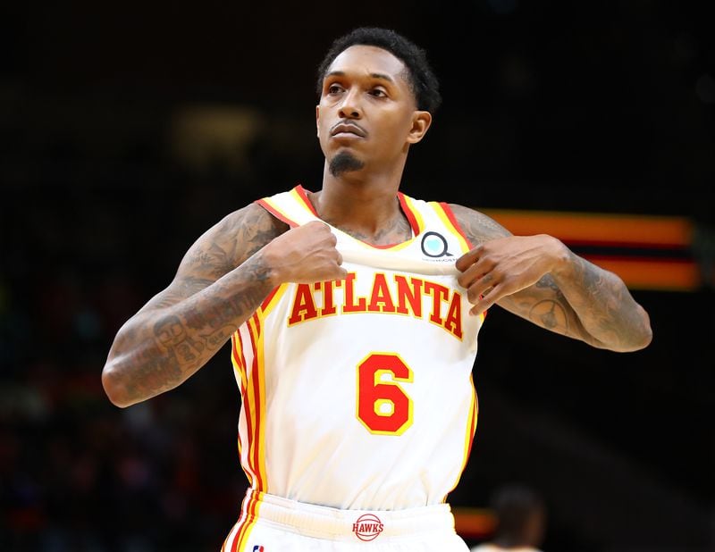 112221 Atlanta: Atlanta Hawks guard Lou Williams shows off his jersey to the fans after scoring against the Oklahoma City Thunder during a 113-101 victory in a NBA basketball game on Monday, Nov. 22, 2021, in Atlanta.    “Curtis Compton / Curtis.Compton@ajc.com”