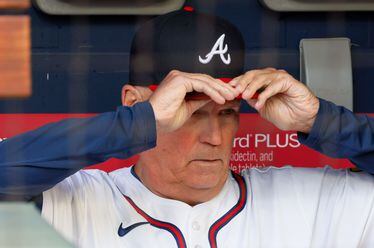 Atlanta Braves manager Brian Snitker (43) adjusts his hat as he watches the field moments the game against the at Truist Park on Tuesday, May 14, 2024.Chicago Cubs 
(Miguel Martinez/ AJC)