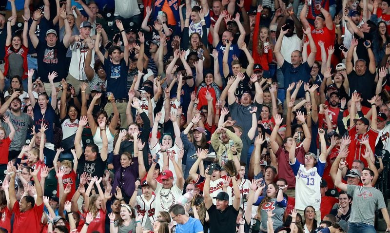 Atlanta Braves fans do the wave while their team clinches the National League East title with a 6-0 victory over the San Francisco Giants in a MLB baseball game on Sept. 20 in Atlanta. Curtis Compton/ccompton@ajc.com