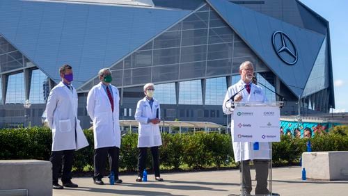 Dr. Robert Jansen, chief medical officer and chief of staff at Grady Health System, speaks at a press conference near the Mercedes-Benz Stadium in Atlanta, Georgia, on Thursday, August 19, 2021. (Rebecca Wright for the Atlanta Journal-Constitution)