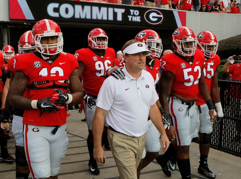 Georgia head coach Kirby Smart leads his team to the field for warmups before a NCAA college football game in Athens against Mississippi State. BOB ANDRES /BANDRES@AJC.COM