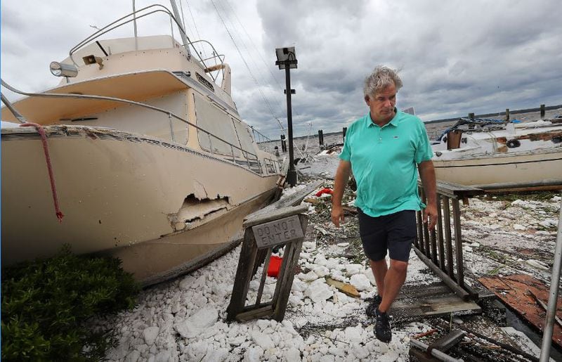 Jay Lassiter surveys the remains of boats and docks after they were destroyed by Hurricane Irma in St. Marys along the Georgia coast. (Curtis Compton/ccompton@ajc.com File Photo)
