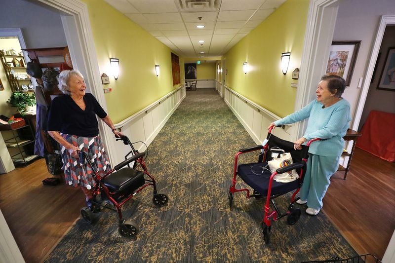 Shirley Jones (left) and Elizabeth Carter share a friendly exchange at the Park Springs senior living community in Stone Mountain. 
Curtis Compton / Curtis.Compton@ajc.com