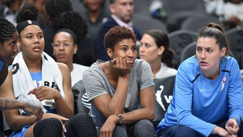 Atlanta Dream forward Angel McCoughtry (center) watches from the nech during a June game. HYOSUB SHIN / HSHIN@AJC.COM