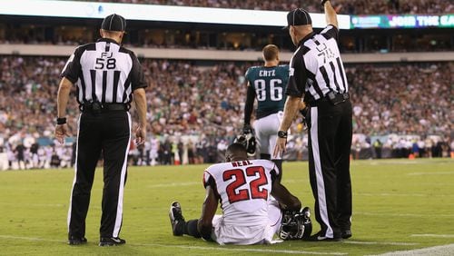 Falcons safety Keanu Neal sits on the ground after suffering a knee injury during the first half Thursday, Sept. 6, 2018, against the Philadelphia Eagles at Lincoln Financial Field in Philadelphia.