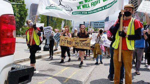 Abortion rights activists rally and march in Atlanta on Saturday. (Arvin Temkar / arvin.temkar@ajc.com)