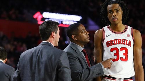 Georgia assistant coach Chad Dollar (center) chats with Georgia forward Nicolas Claxton (33) following the end of a timeout during a men's basketball game betweenGeorgia and Ole Miss at Stegeman Coliseum on Saturday, Feb. 9, 2019. Georgia assistant coach Joe Scott (left) is part of the conversation. (Photo by Kristin M. Bradshaw/UGA)