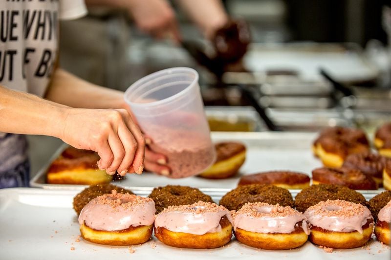 Anna Gatti and her two-person team start their eight-hour days at 1 a.m., hand rolling, cutting, frying and decorating between 1,200 and 1,500 doughnuts. CONTRIBUTED BY DOUGHNUT DOLLIES