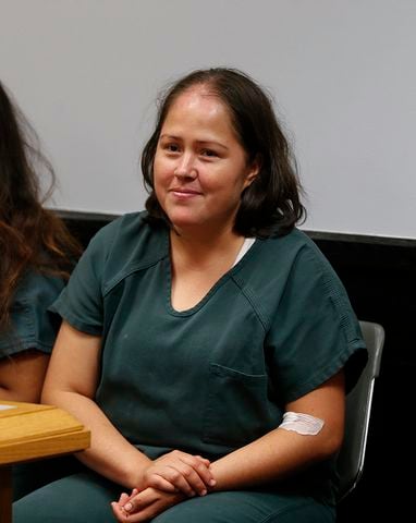 Photos: Georgia mother charged with stabbing family smiles in court
