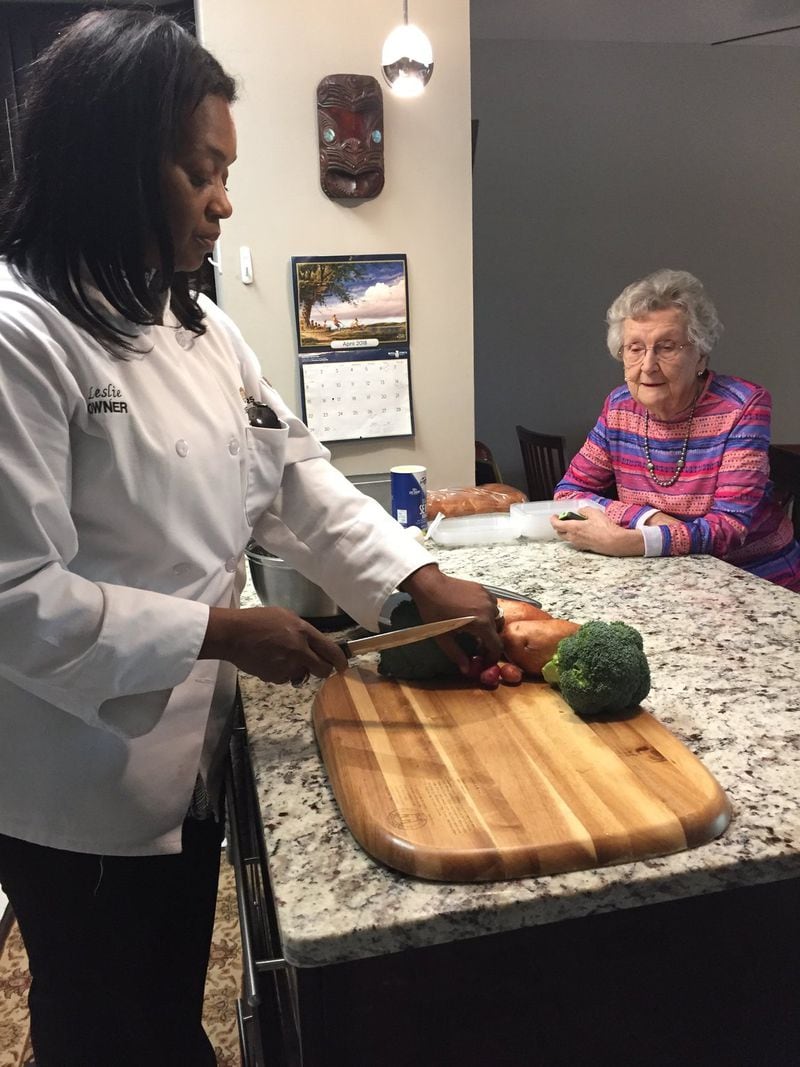 Leslie Chapman, owner of the Atlanta franchise of Chefs for Seniors, chats with client Dolores Lane. It’s important for the chef and the client to get to know each other, and conversation about food preferences and cooking are part of the service. Photo: C.W. Cameron