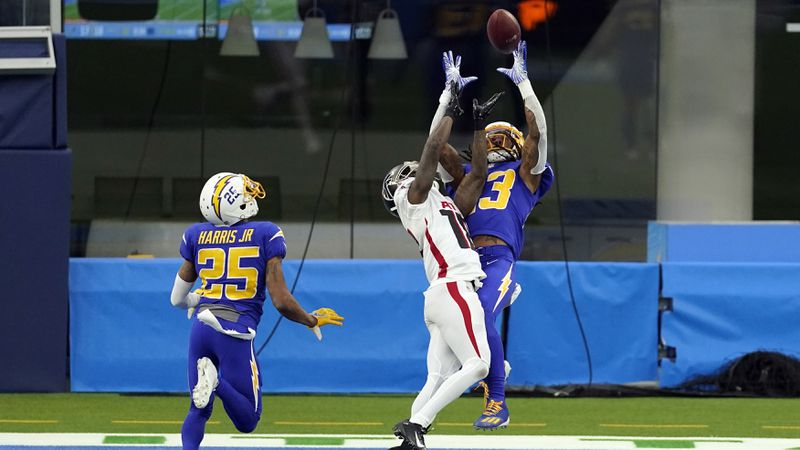 Los Angeles Chargers strong safety Rayshawn Jenkins (right) intercepts a pass in the end zone intended for Atlanta Falcons wide receiver Calvin Ridley (center) during the second half Sunday, Dec. 13, 2020, in Inglewood, Calif. (Ashley Landis/AP)