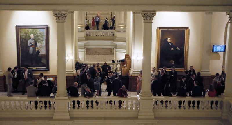Lobbyists gather on the balcony outside of the House chamber. Thursday was the 40th and final day of the 2018 General Assembly. BOB ANDRES /BANDRES@AJC.COM
