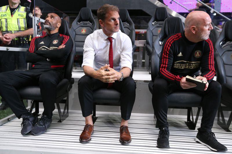Atlanta United head coach Frank de Boer (center) and assistant coaches take the bench for the game against Orlando City Sunday, May 12, 2019, in Atlanta.