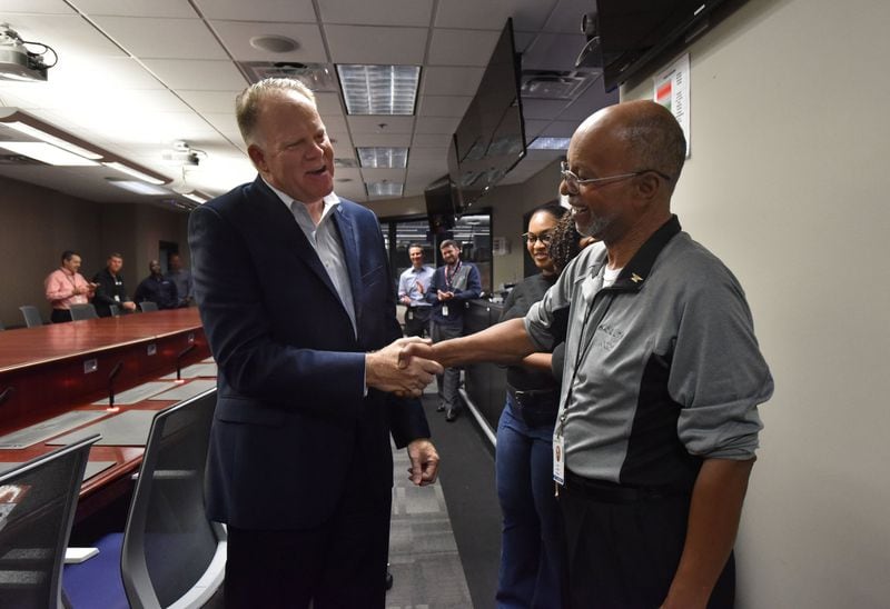 October 25, 2018 Atlanta - Joe Jackson (right), who will retire after 50 years, gets a handshake from Gil West, Chief Operating Officer for Delta Air Lines, during Jackson’s retirement gathering at Delta Operations/Customer Center on Thursday, October 25, 2018. Joe Jackson, Delta’s first African American dispatcher and duty director is retiring after 50 years at Delta. Joe started his career at Delta in 1968 first on the ramp in Florida before becoming a dispatcher in 1980 here in Atlanta. He’s been in Delta’s Operations and Customer Center ever since, eventually rising to the level of Duty Director where he had oversight over Delta’s entire global operation. HYOSUB SHIN / HSHIN@AJC.COM
