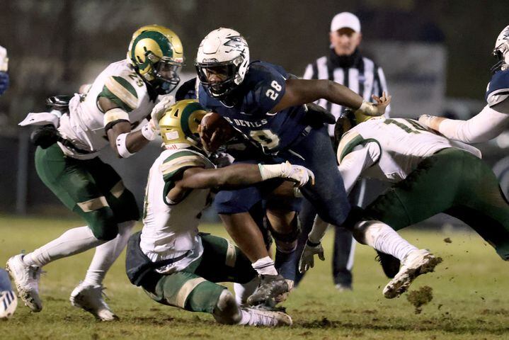 Dec. 18, 2020 - Norcross, Ga: Grayson defenders tackles Norcross running back Jahni Clarke (28) for a short run in the first half of the Class AAAAAAA semi-final game at Norcross high school Friday, December 18, 2020 in Suwanee, Ga.. JASON GETZ FOR THE ATLANTA JOURNAL-CONSTITUTION